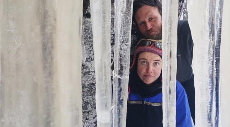 Photo of Amy and Dave freeman looking through icicles