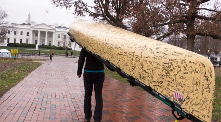 carrying signed canoe to the White House