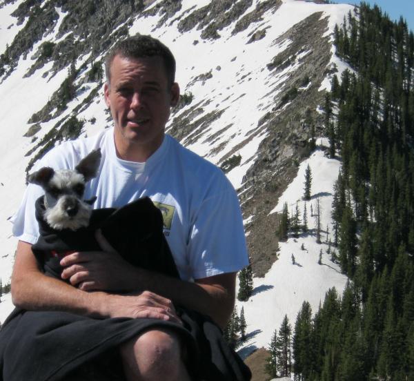 Tom Hess with dog on Mountain 