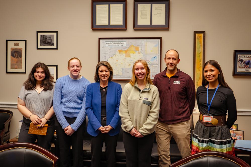 Kids with Rep Angie Craig in an office