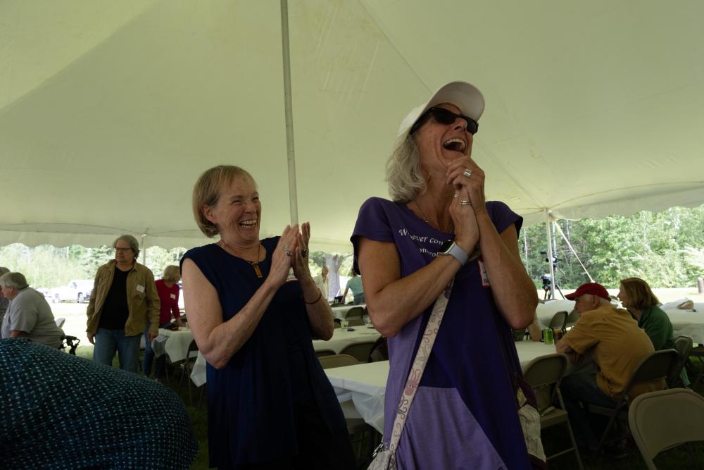 two women laughing at the garden party