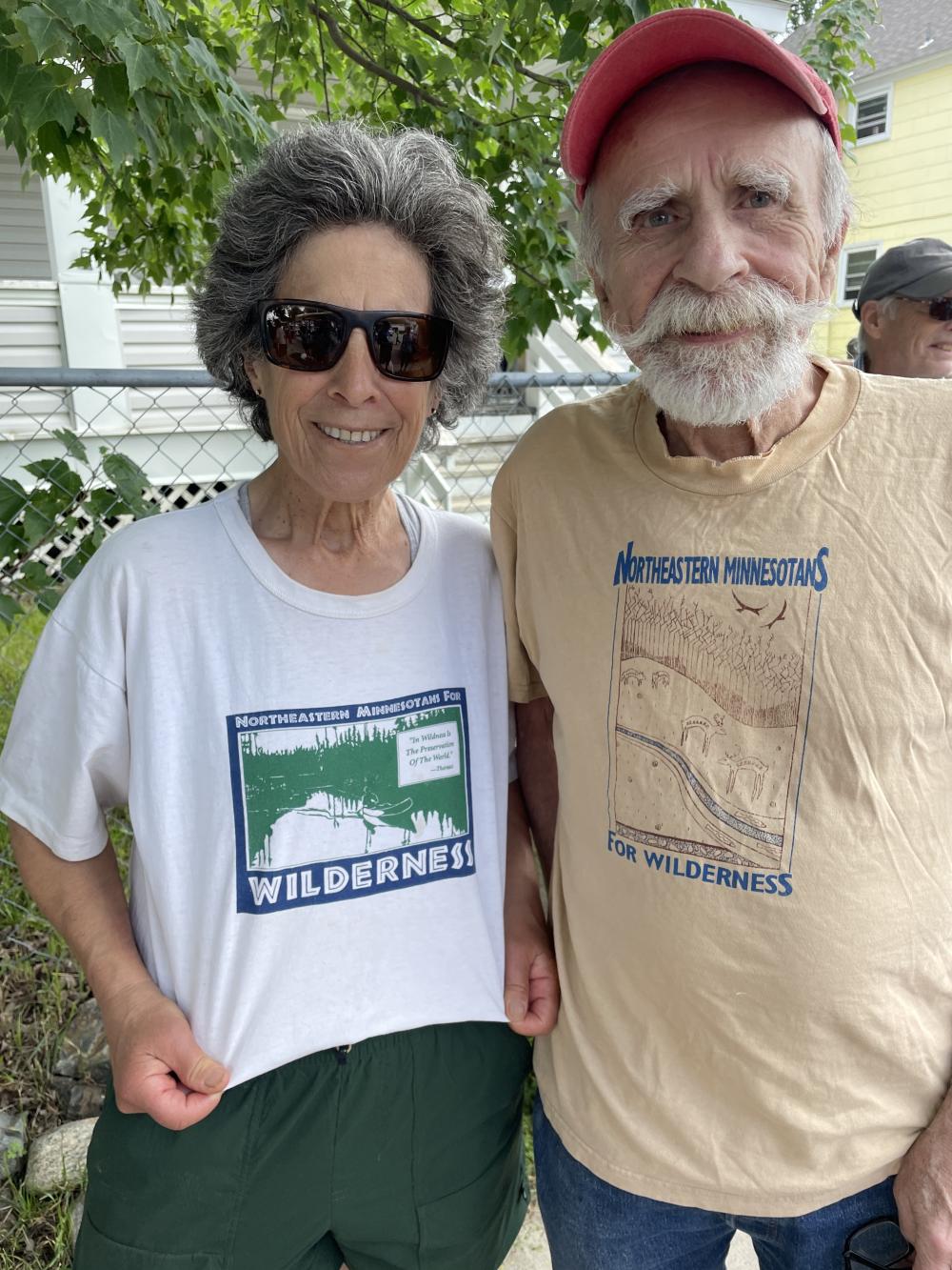 two people with Northeastern Minnesotans for Wilderness vintage shirts